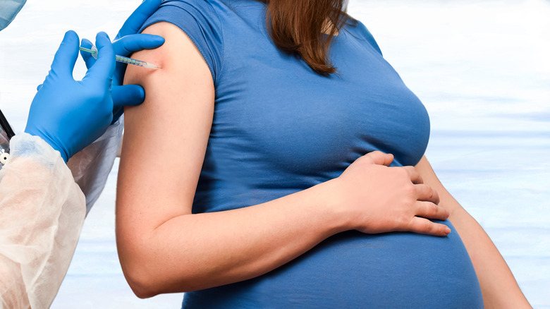 A pregnant woman gets vaccinated