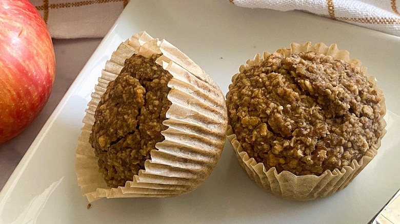 Two muffins sitting on a plate