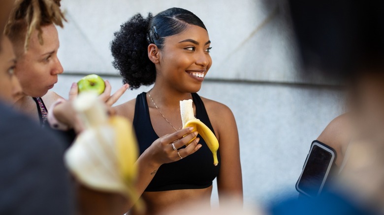 Girl eating banana