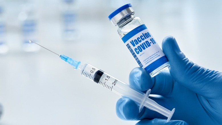 Person holding COVID-19 vaccine 