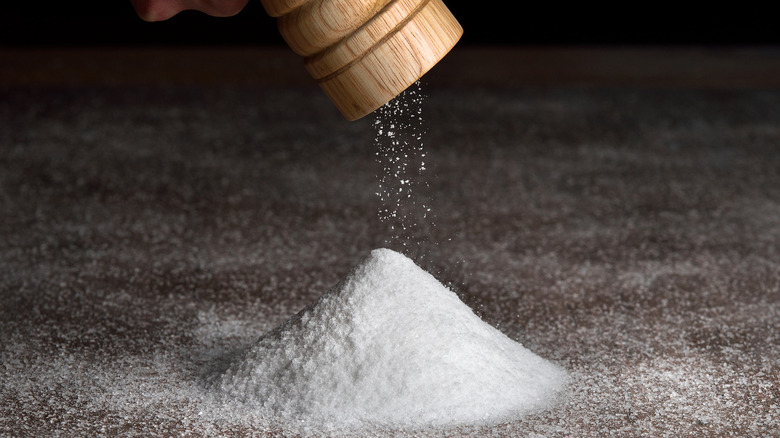 Salt falls from a salt shaker