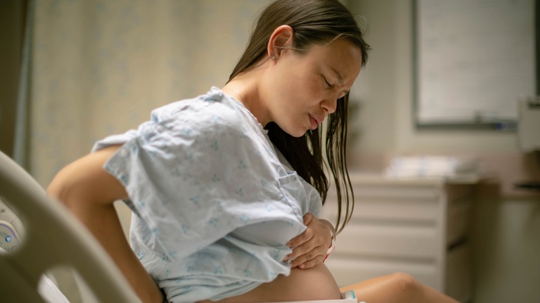 Pregnant woman experiencing discomfort during labor