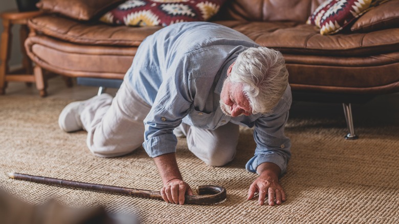 an elderly man falls at home