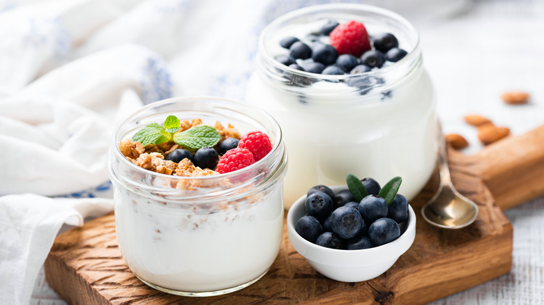 yogurt with blueberries in glass jars 