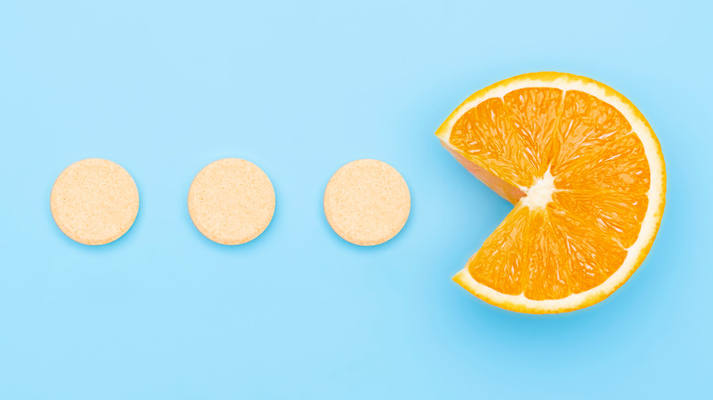 Vitamin C supplements with C-shaped orange