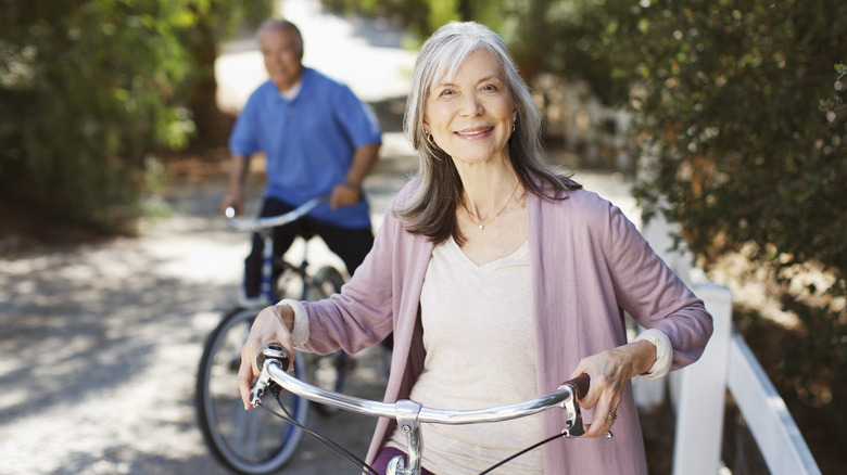 Smiling woman on a bike