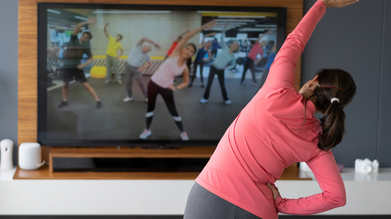 woman watching exercise class