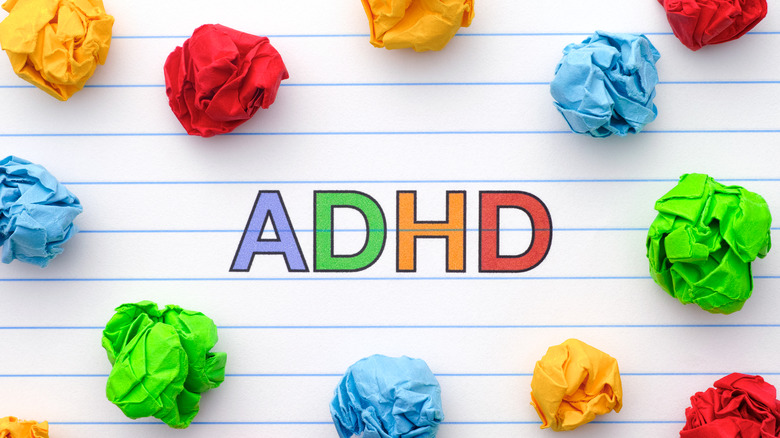 ADHD written in colorful letters and surrounded by tufts of colored paper
