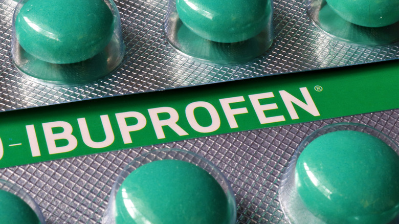 Green Ibuprofen tablets in packet