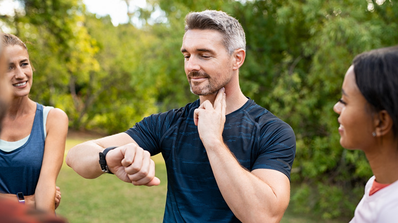 Man checking pulse after workout