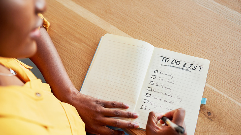 Woman looking at her to-do list