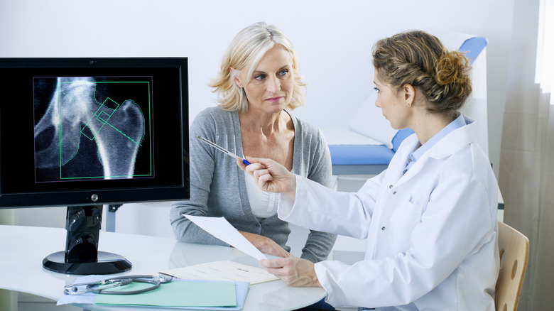 Woman consulting doctor after X-ray