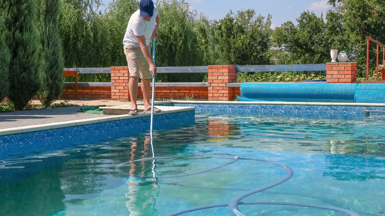 Man doing pool maintenance