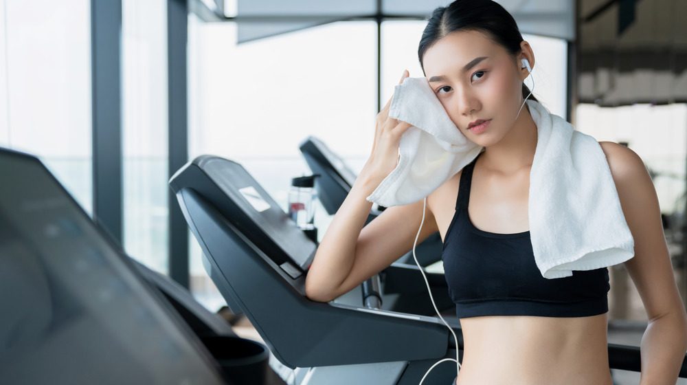 woman cooling down on treadmill