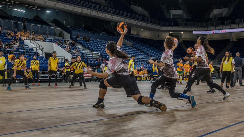two competitive dodgeball teams playing a match 