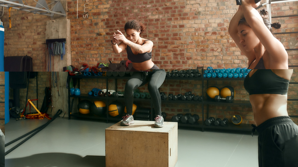 Two women doing box jumps in a gym