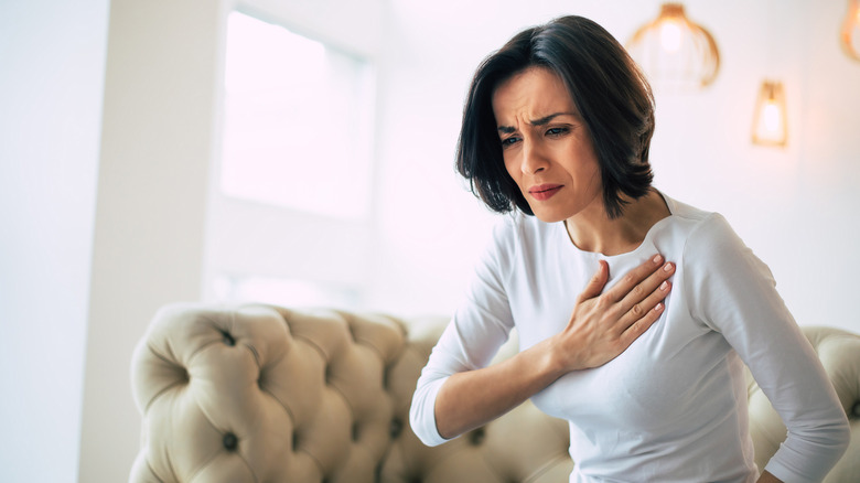A woman suffers from chest pain
